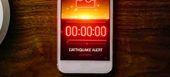 A phone showing an earthquake alert